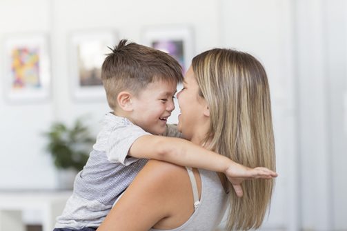 Woman holding a smiling child