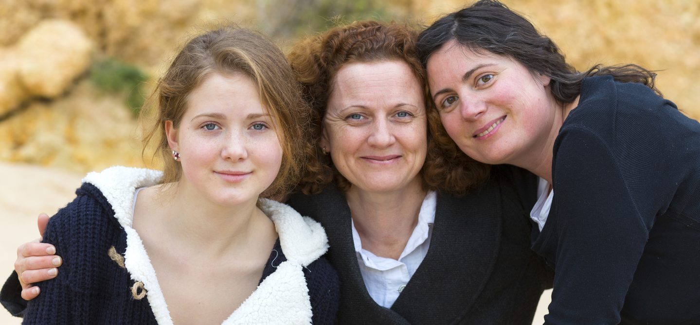 Mum with teenage daughter and adult daughter