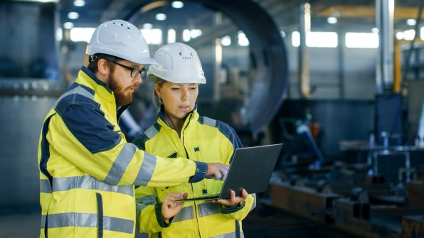 Engineers talking at work