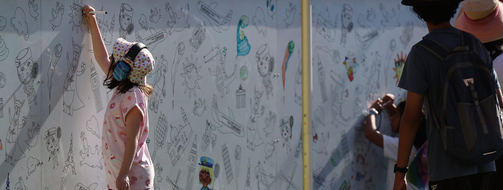 Girl drawing on banner